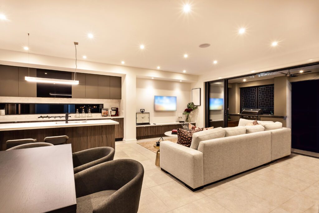 Modern open-concept kitchen and living area with stylish decor.